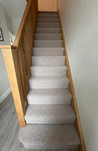 Lovely textures herringbone fitted to this stairs & landing